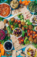 Mezze

A mezze a Közel-Kelet előétele: azokat az apró kis fogásokat nevezik mezzének, amelyek célja, hogy étvágyat csináljanak a főétkezés előtt. A libanoni mezzék sajátossága, hogy annyira bőséges és tápláló, hogy ezek a fogások akár főételként is megállják a helyüket. Létezik meleg és hideg mezze, a főszerepben azonban szinte mindkét variácóban a csicseriborsó, az olajbogyó, a joghurt, különféle sajtok és a padlizsán van, valamint ide sorolhatók még az olyan mártogatósok is, mint a hummusz, de a különböző saláták (bulgur, zöldség) is helyet kaphatnak a lepénykenyerek mellett