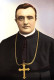 A 25 éves Schmidtet 1904-ben Németországban katolikus pappá szentelték, ezután pedig két gyermekkori szenvedélye végül nyugtalanító módon közeledni kezdett egymáshoz. 1908-ban kivándorolt az Egyesült Államokba, miután diplomahamisítással vádolták meg, 1912-ben pedig már a manhattani Szent Bonifác templomban tevékenykedett, mint segédlelkész.