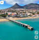A szélmalmok és a háborítatlan nyugalom világa - Porto Santo történelmileg fontos gabonatermelő vidéki központ volt: egykor több mint 40 szélmalom működött a sziget szelesebb pontjain. Mára alig néhány maradt meg belőlük, köztük az a három ikonikus építmény, amely a Portela kilátónál magasodik az ég felé. A sziget a nyári főszezon (június-augusztus) néhány hetét kivéve – amikor a portugál szárazföldről és a strandok nélküli Madeiráról érkeznek a nyaralók – a tökéletes béke szigete. A közvetlen szárazföldi járattal rendelkező lisszaboni átszállással vagy a Madeiráról induló komppal elérhető Porto Santo valódi menedék a természet szerelmeseinek.