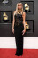 Grammy-díjátadó - 2022.

A 2022-es Grammy-díjátadon az énekesnő egy Versace ruhát viselt, melyet 1992-ben láthattak először az emberek a kifutón, egykor Cindy Crawford viselte a különleges ruhakölteményt. A keresztben futó bőrpántok, a nyakán viselt rengeteg ékszer és a platinaszőke haj pedig csak mind még extravagánsabbá varázsolta&nbsp;Dua Lipa megjelenését.
